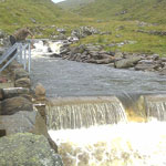 Burn in full flow over weir